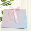 Elegant Customizable Paper Handbags for Boutique Shopping Experiences